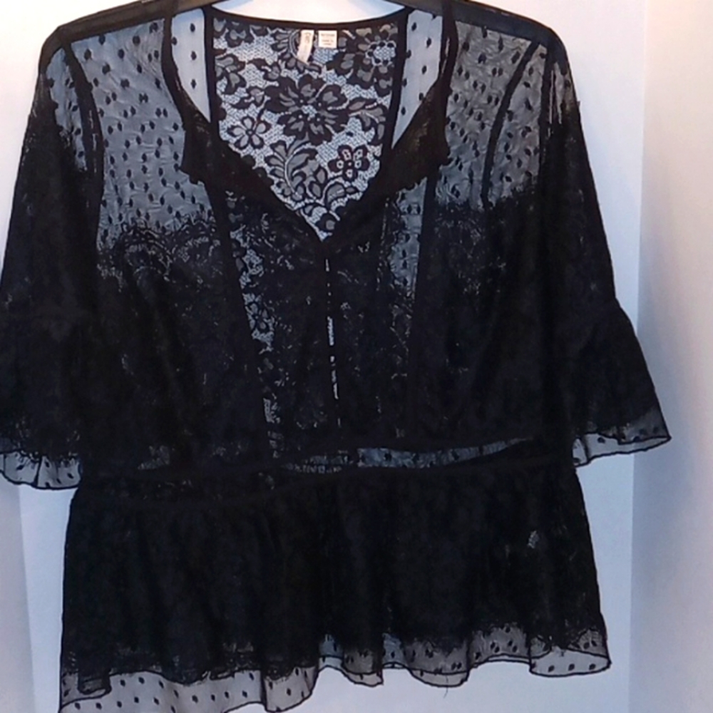 Beautiful lace blouse. Will need to wear camisole of your choice beneath it.